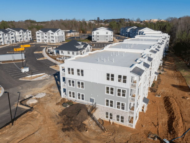 an aerial view of commercial flat roofs of an apartment building